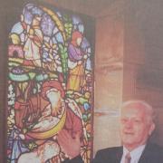 Arthur Sinclair, Slaley churchwarden, with stained glass windows which were back on view after being hidden for decades in 1998