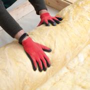 An image of insulation being installed in a home.