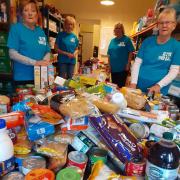 Volunteers with donations at a Northumberland foodbank