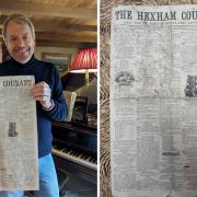 Ben Knibbs in his cottage with the first edition of the Hexham Courant, dated 1864