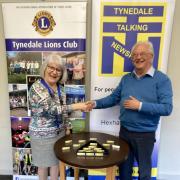 Chair of TTN Dave Clegg thanking Lions president Julia d’Auvergne Oake for covering the cost of 150 memory sticks
