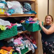 Rosie Gilchrist with donated items at Hexham Children and Baby Bank.