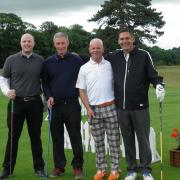 Charity golf organiser Stewart Bailey (second from right).