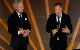 Charlie Mackesy, left, and Matthew Freud accept the award for best animated short for The Boy, the Mole, the Fox and the Horse at the Oscars on Sunday, March 12, 2023, at the Dolby Theatre in Los Angeles