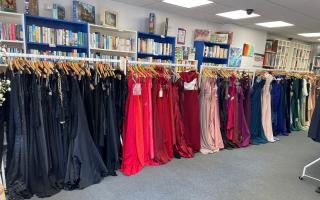 A rainbow of dresses waiting to be picked!