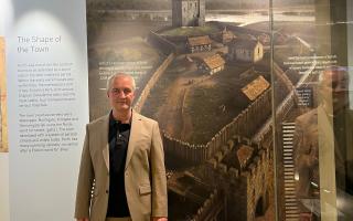 Simon Edwards at the Perth Museum in front of the image of Perth Castle he created, which is in the medieval exhibition